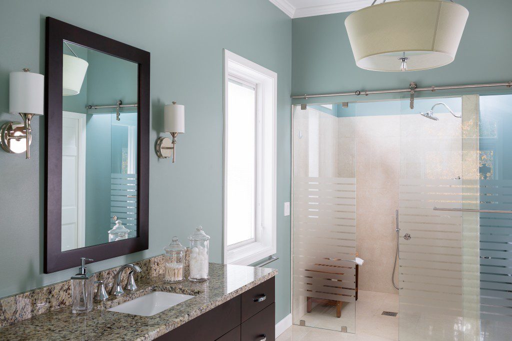 Sliding shower system with curbless shower. www.designsbybsb.com #curbless #bathroomdesign #slidingdoor #barndoor