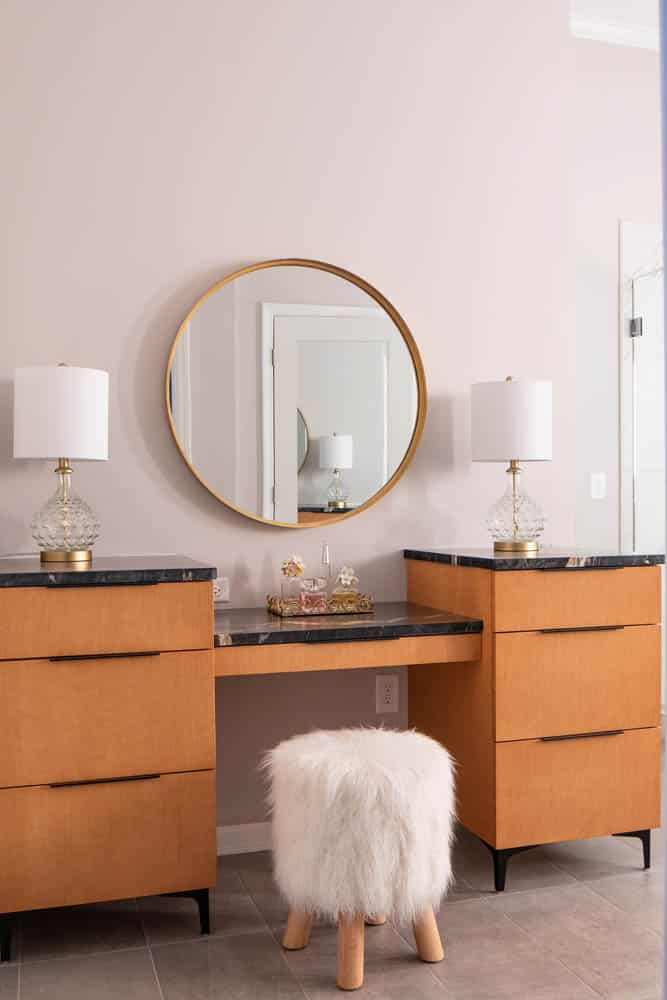 bathroom vanity with round mirror