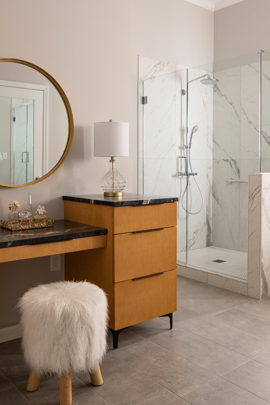 Bathroom vanity and marble floor and shower